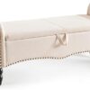 Modern storage bench with cushioned seat and hidden compartment.