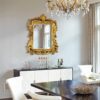 Elegant antique gold mirror with ornate vintage frame for home decor.