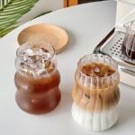 Ribbed glass cups with vintage striped texture, perfect for cocktails, iced coffee, and everyday beverages.