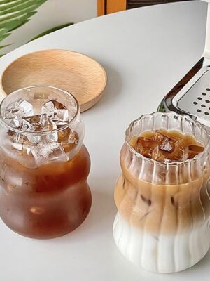Ribbed glass cups with vintage striped texture, perfect for cocktails, iced coffee, and everyday beverages.