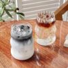 Minimalist ribbed drinking cup with clear finish, stylish glassware for cocktails.