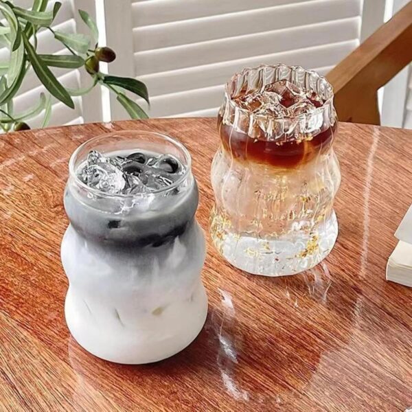 Minimalist ribbed drinking cup with clear finish, stylish glassware for cocktails.