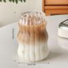 Premium ribbed iced coffee glass with textured grip.