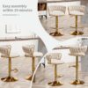 Elegant gold metal frame counter stools with upholstered seat.