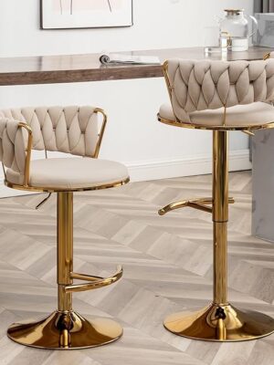 Golden bar stools with versatile design for modern interiors.