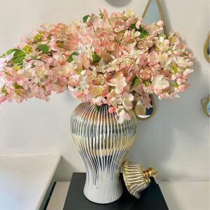 White and gold vase with lid – stylish decorative accent for living room or dining table
