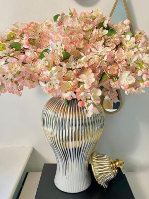 White and gold vase with lid – stylish decorative accent for living room or dining table