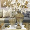 Modern ceramic jar vase with white finish and gold ribbing
