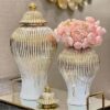 Elegant white and gold ceramic vase with lid for home decor
