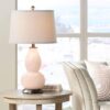 Stylish modern desk lamp providing soft ambient lighting.