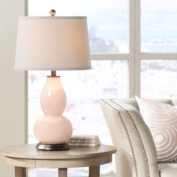 Stylish modern desk lamp providing soft ambient lighting.