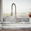 High-arc stainless steel kitchen faucet with flexible sprayhead.